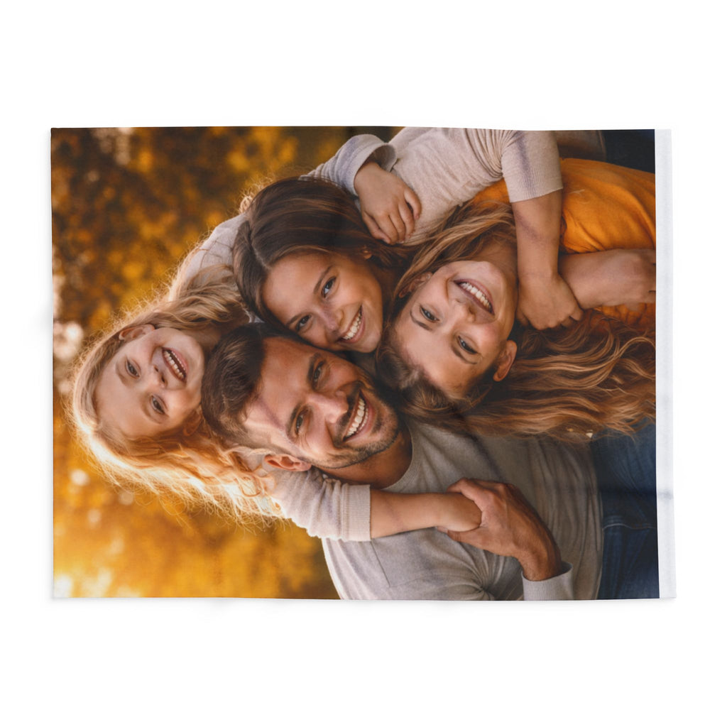 Family of four posing together with a warm, autumnal background